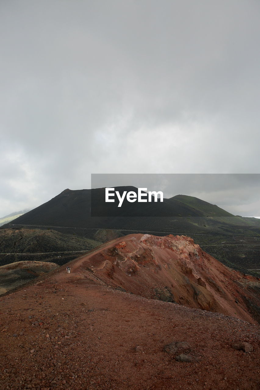 Scenic view of volcanic landscape against sky