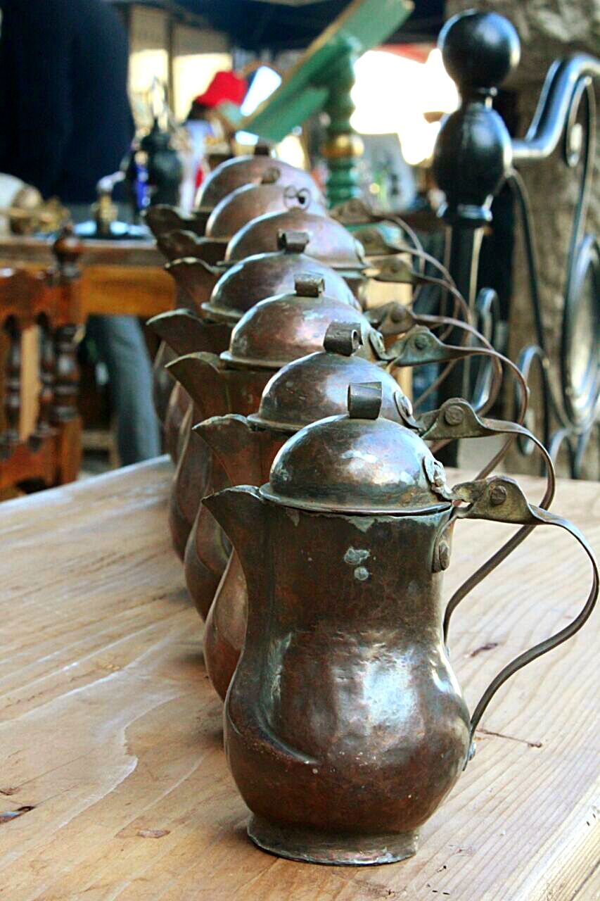 CLOSE-UP OF WINE ON TABLE AGAINST WALL