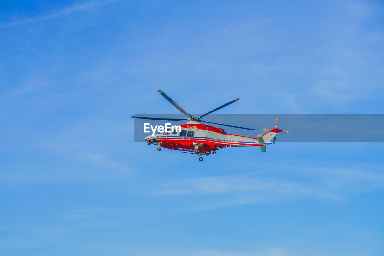 low angle view of airplane flying against clear sky