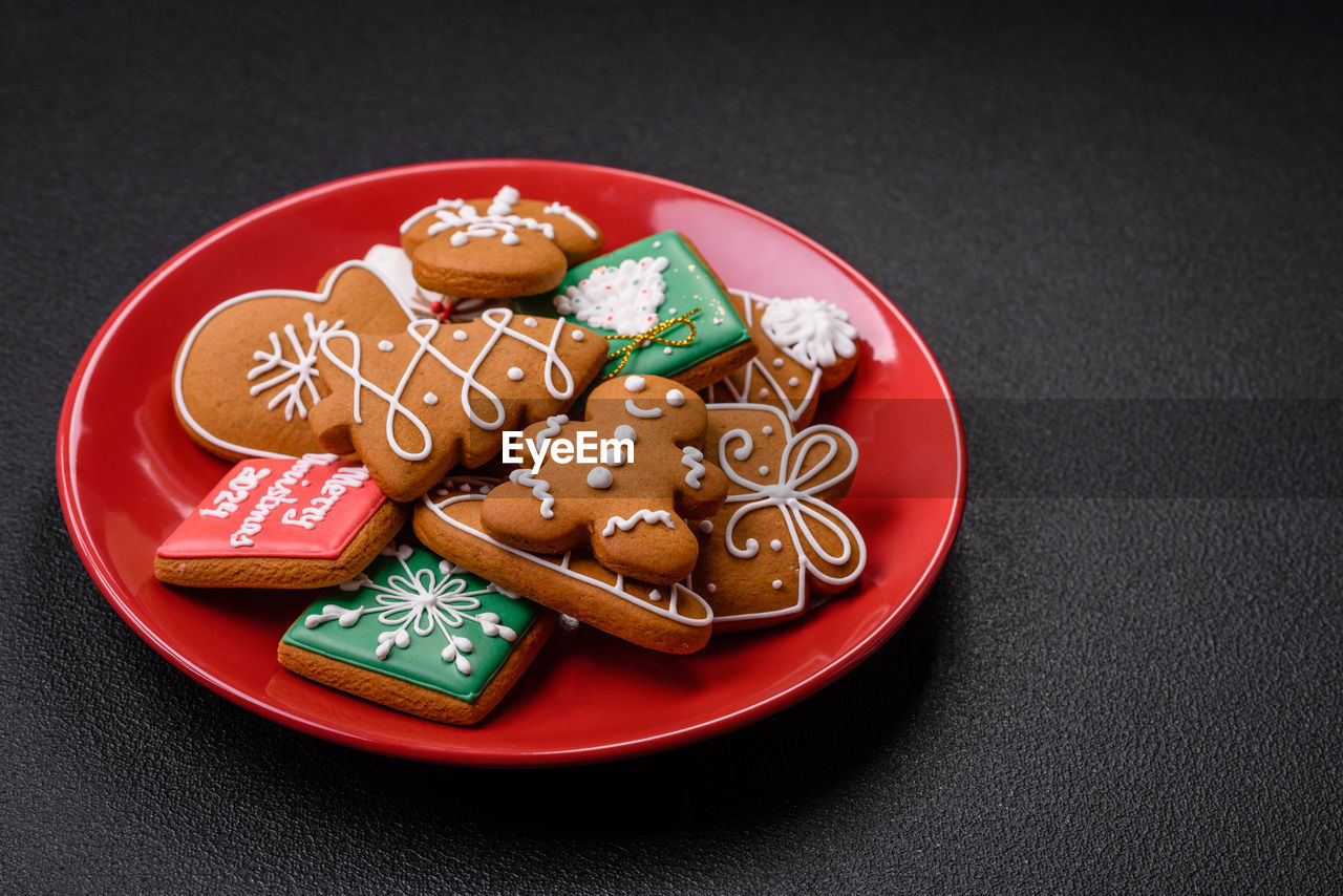 food and drink, food, sweet food, plate, sweet, baked, celebration, studio shot, cookie, event, no people, snack, dessert, holiday, indoors, tradition, red, christmas, candy, still life, decoration, gingerbread cookie