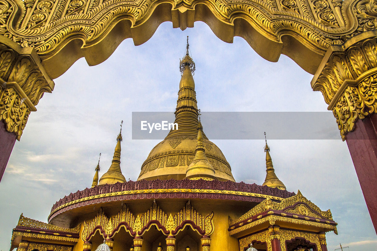 Low angle view of gold colored buddhist temple