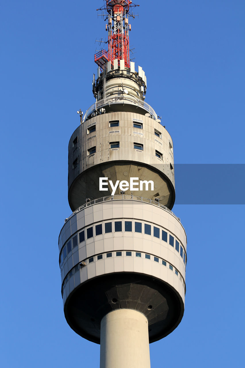 Low angle view of lighthouse against clear blue sky