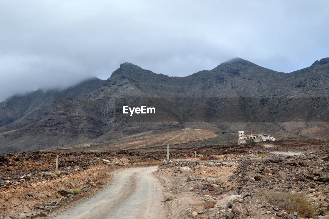 ROAD PASSING THROUGH MOUNTAINS