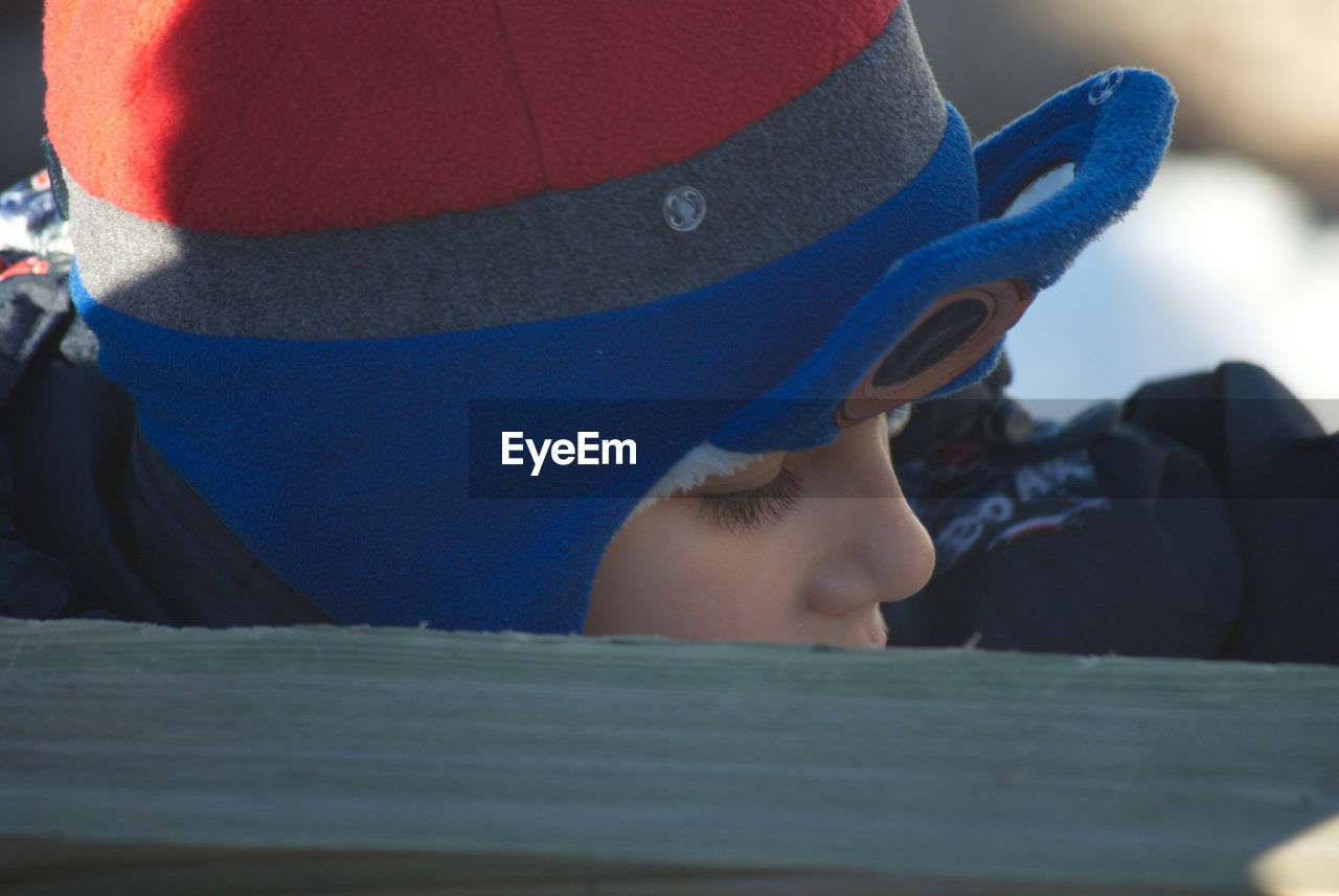 CLOSE-UP PORTRAIT OF BOY LOOKING AT CAMERA