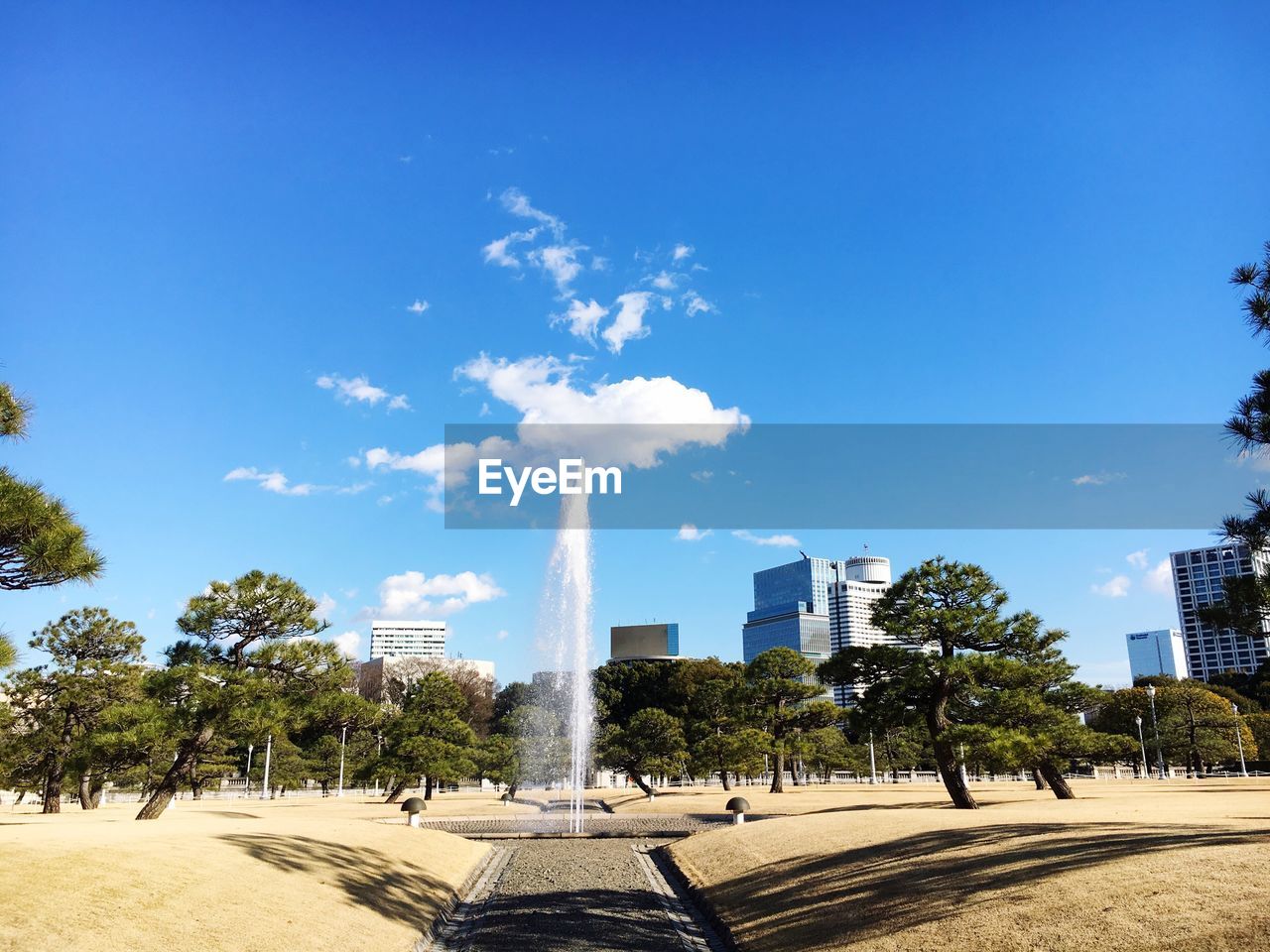 VIEW OF CITYSCAPE WITH BLUE SKY IN BACKGROUND