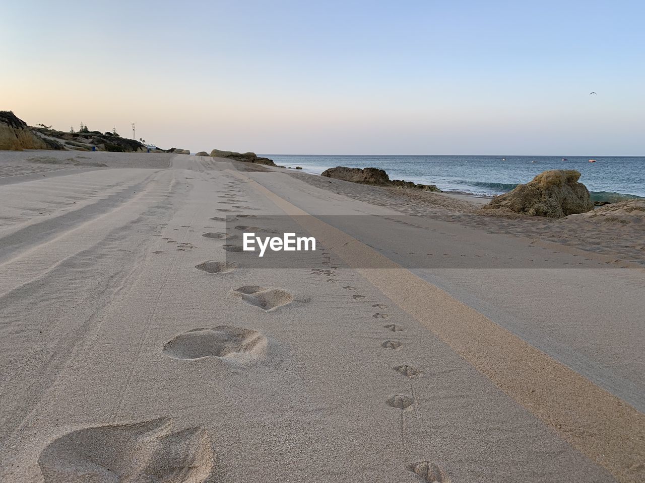 Scenic view of beach against clear sky