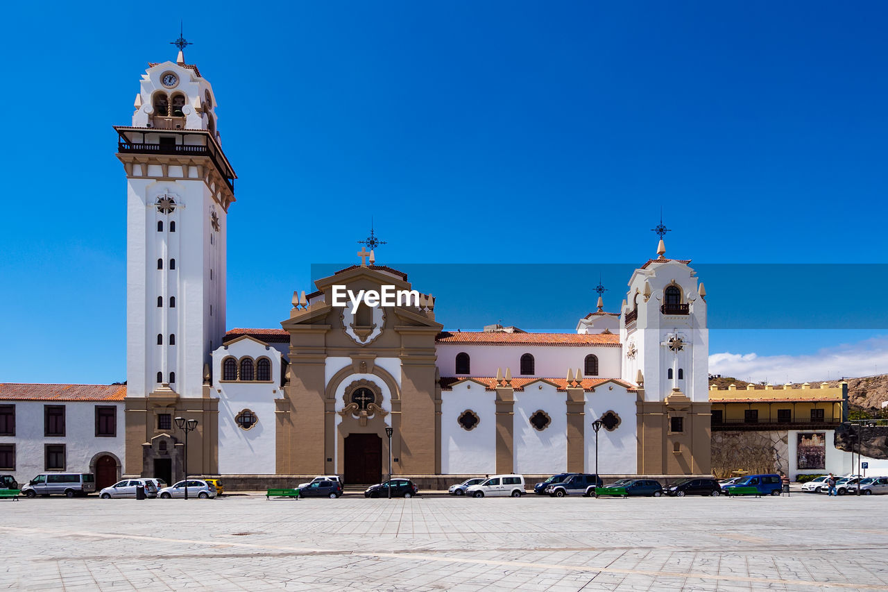 FACADE OF CHURCH AGAINST BLUE SKY