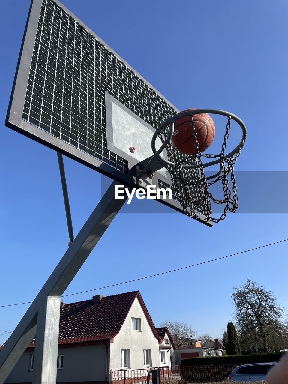 low angle view of basketball hoop against clear blue sky