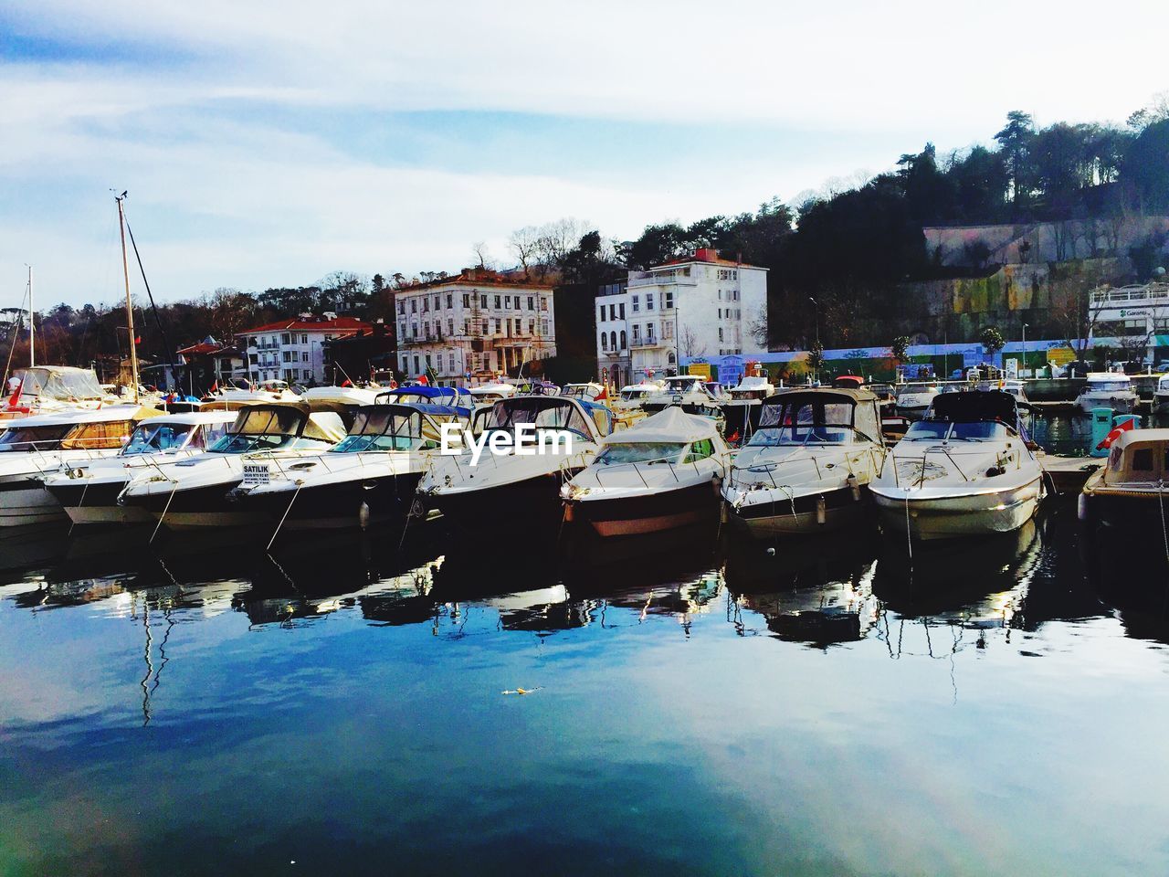 BOATS MOORED IN HARBOR