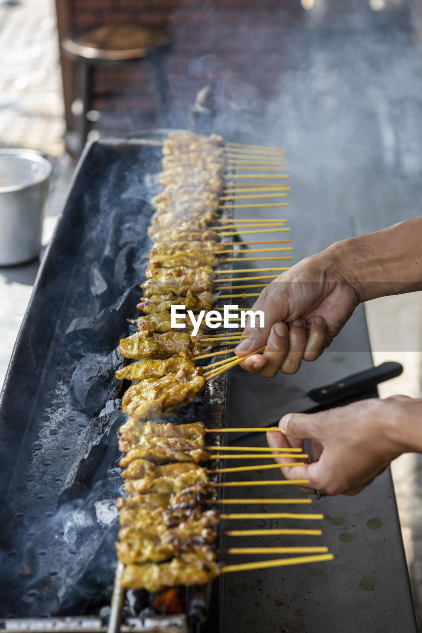 cropped image of man preparing food