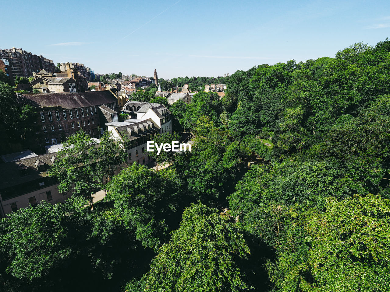 High angle view of trees and buildings against sky