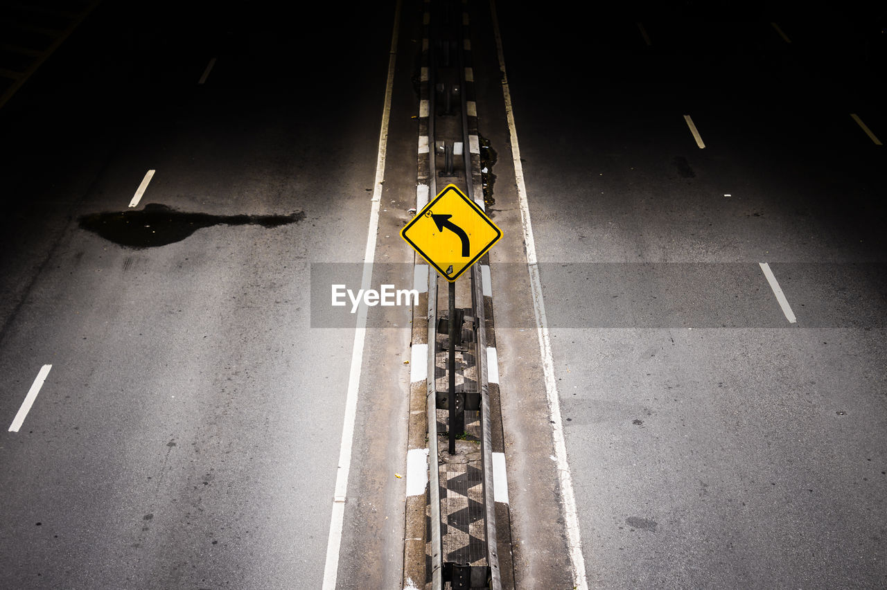 ROAD SIGN ON ASPHALT