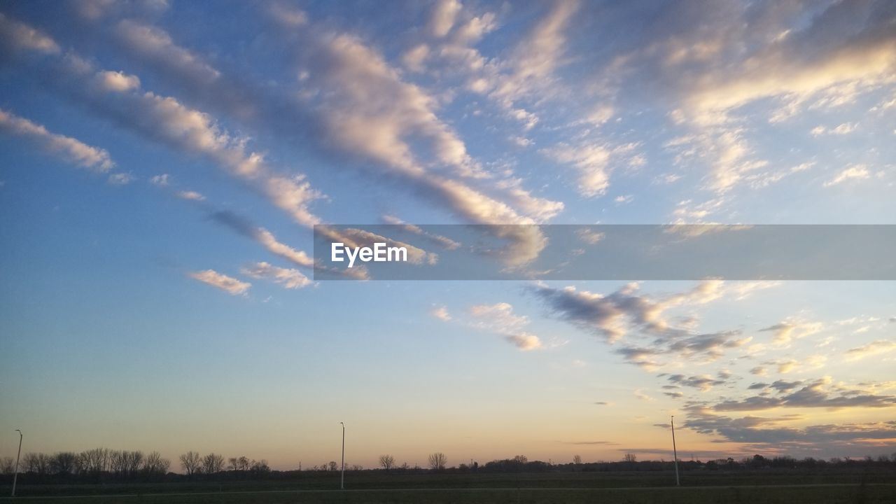 LOW ANGLE VIEW OF SKY OVER SILHOUETTE LANDSCAPE