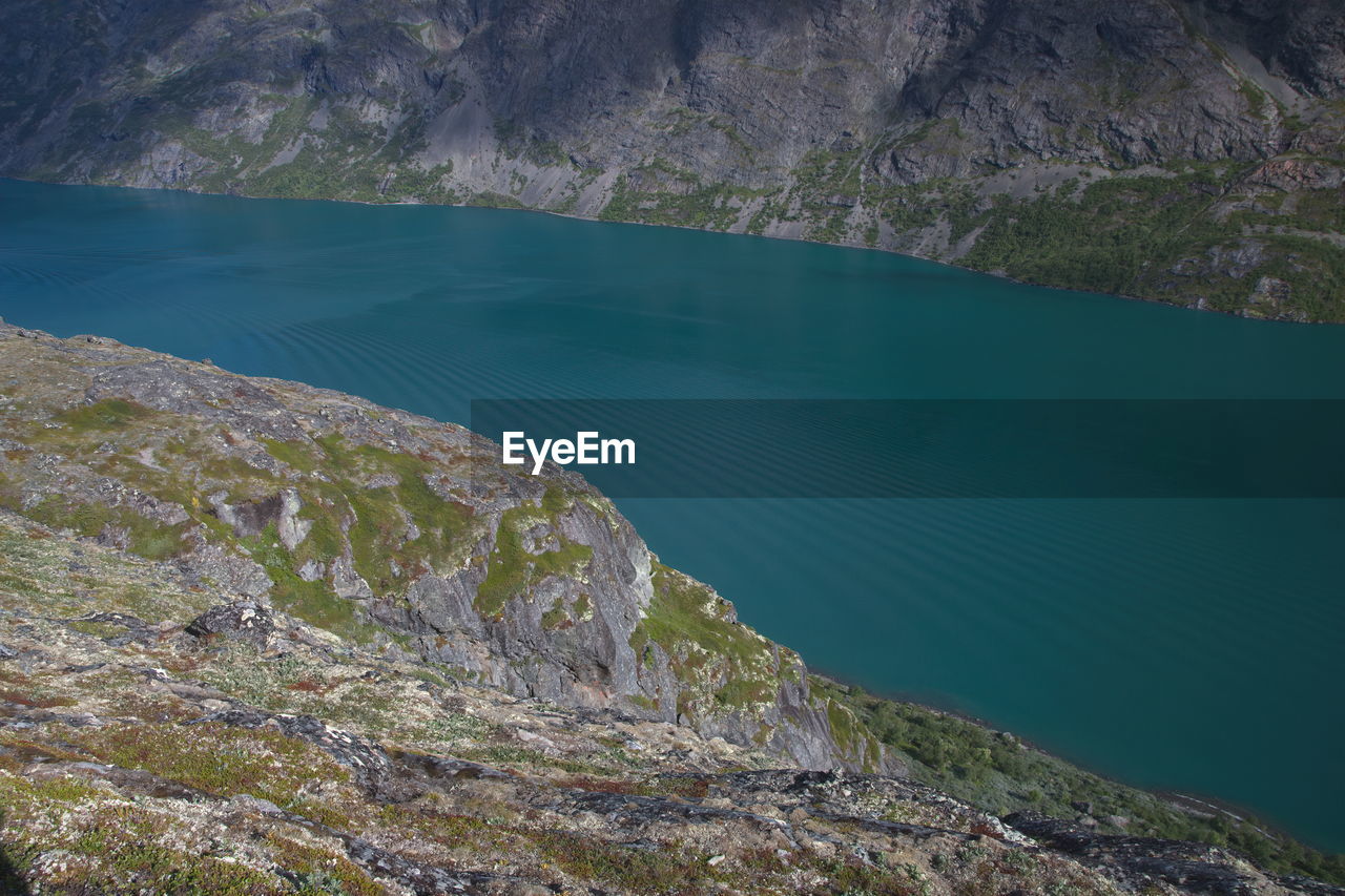 High angle view of lake by mountain
