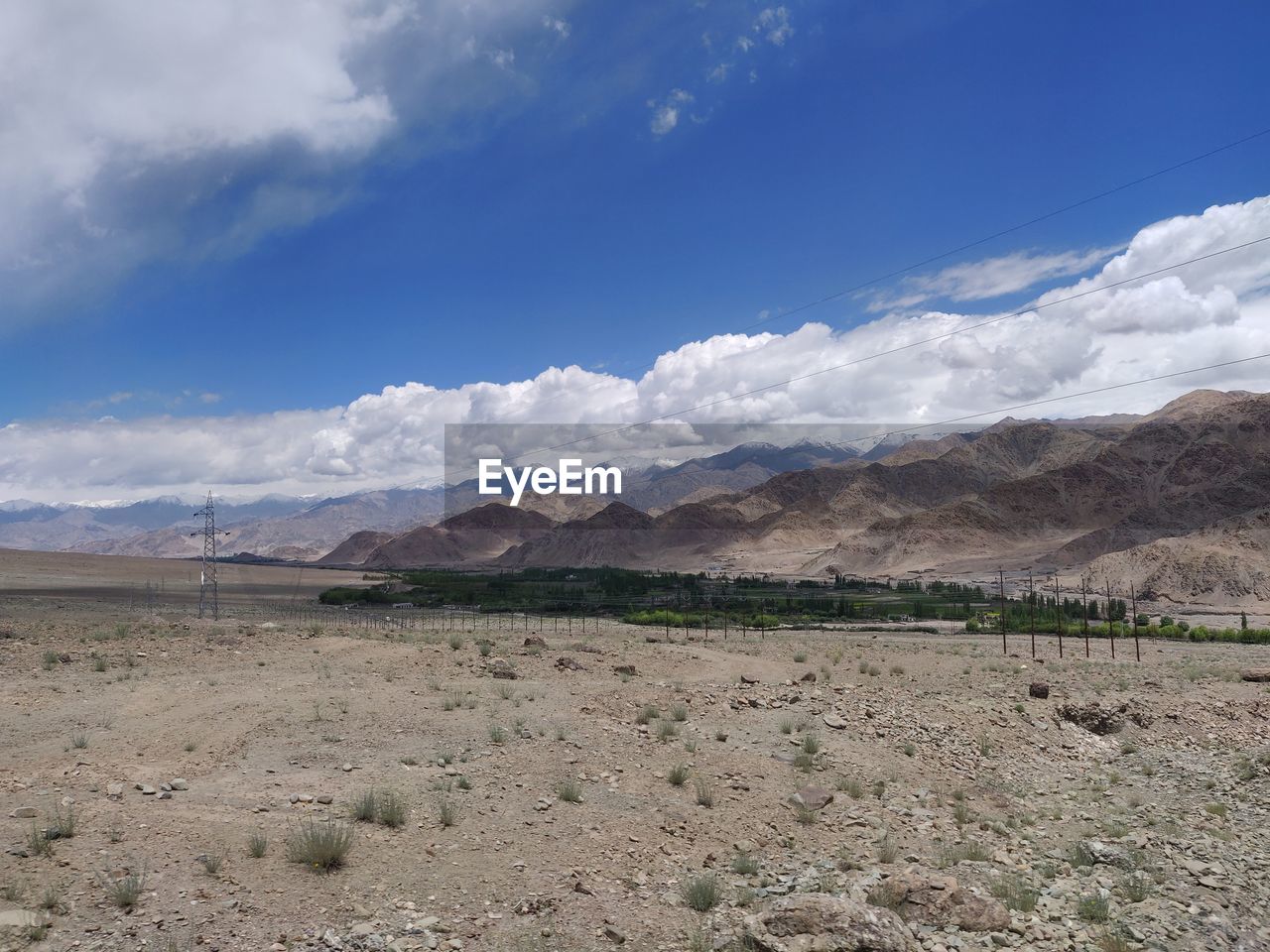 SCENIC VIEW OF LANDSCAPE AND MOUNTAINS AGAINST SKY