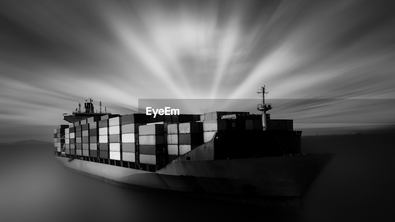 Black and black motion blur ship container transporting large cargo logistic import export goods 