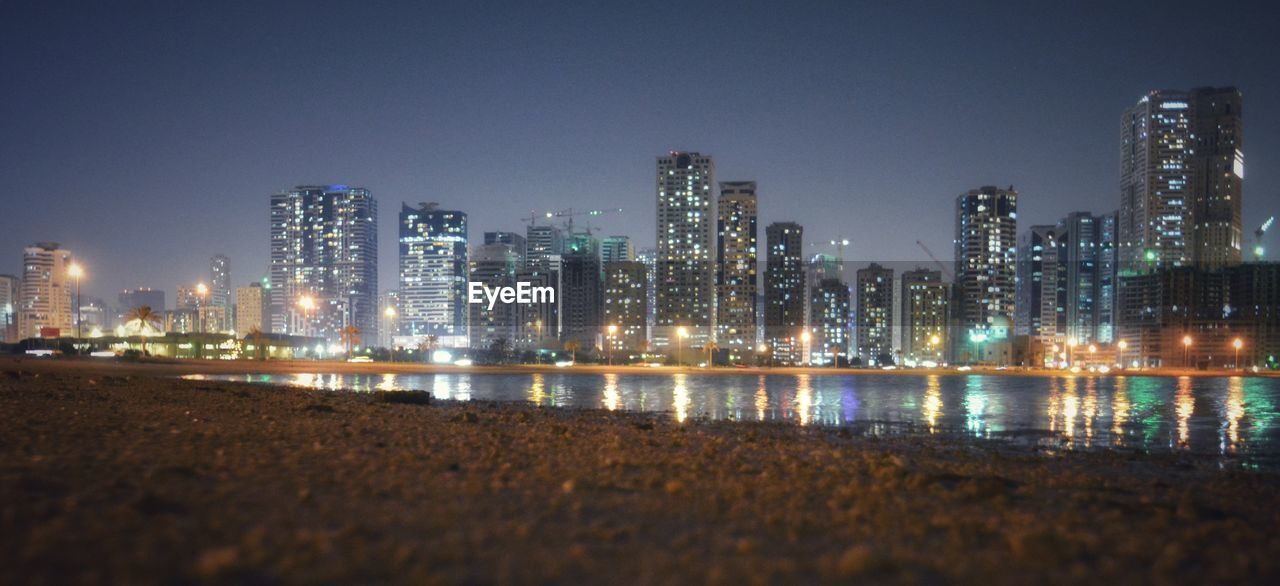 Illuminated buildings in city at night