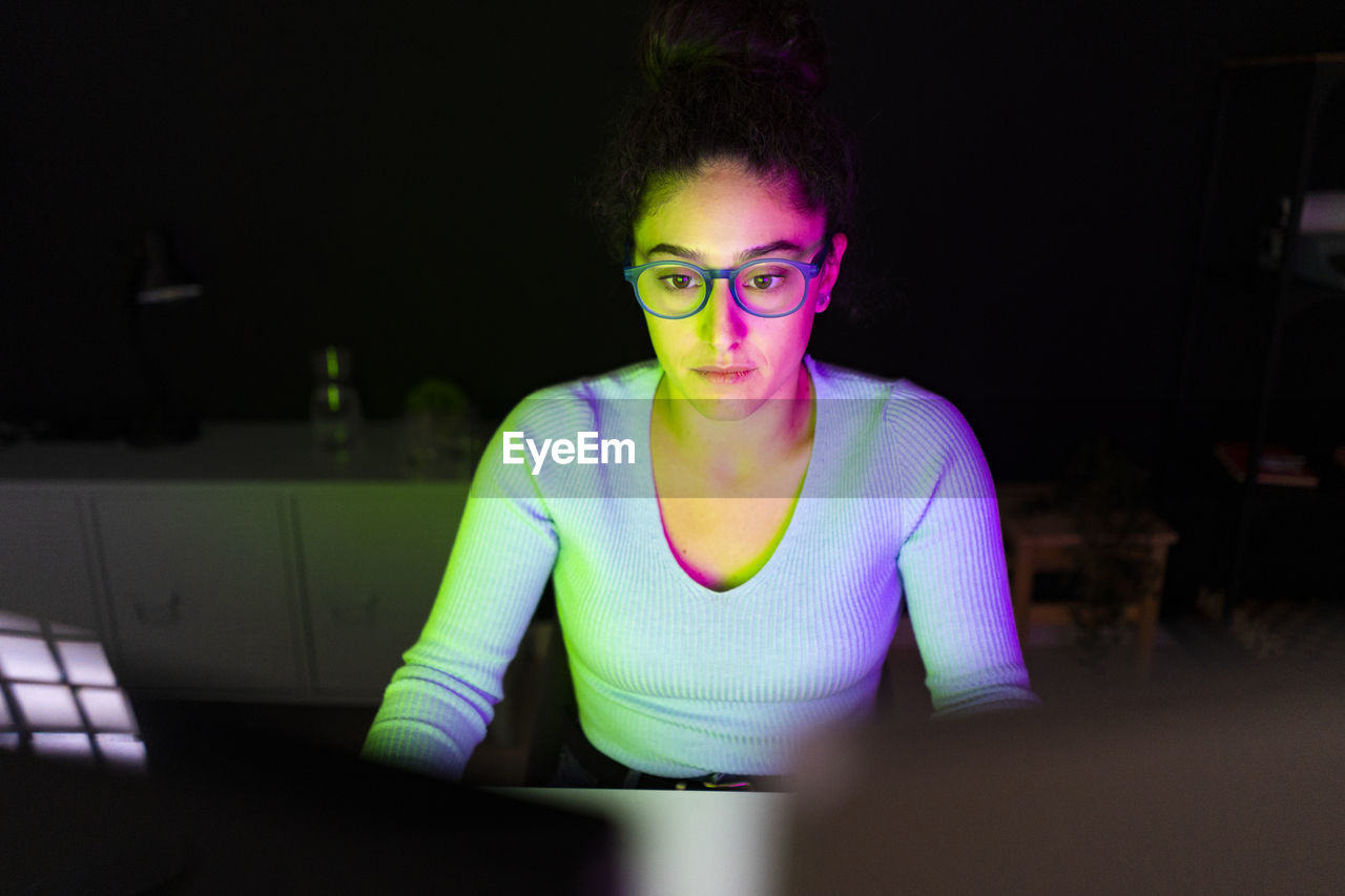 Freelance worker with eyeglasses working at home office