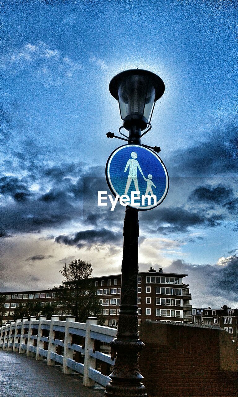 VIEW OF STREET LIGHT AGAINST CLOUDY SKY