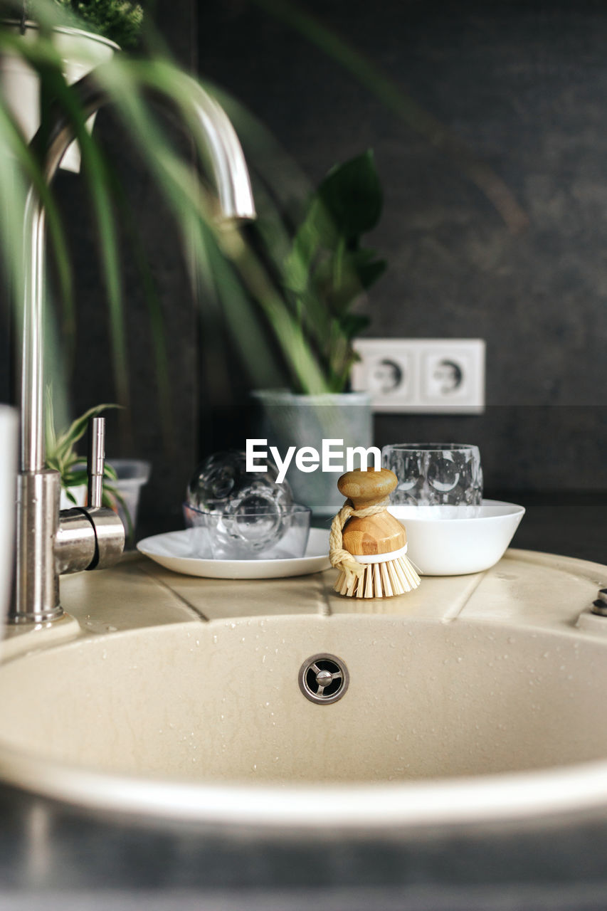 Ecological natural dish brush lies on the sink