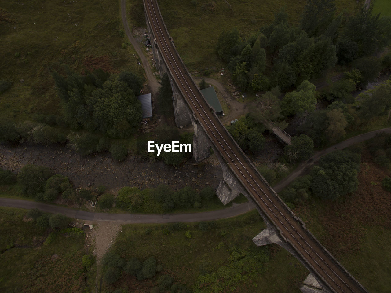 HIGH ANGLE VIEW OF RAILROAD TRACK AMIDST TREES