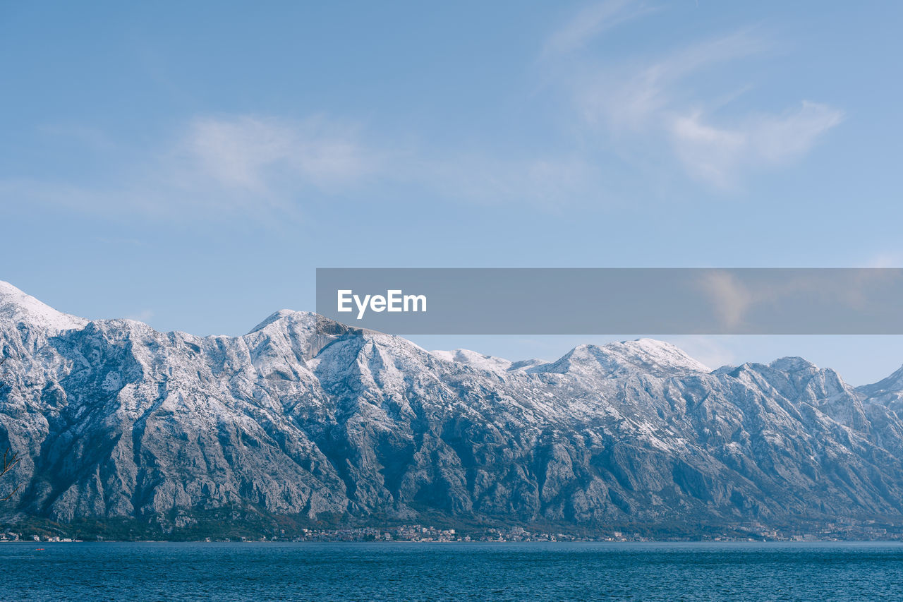 SNOWCAPPED MOUNTAINS AGAINST SKY