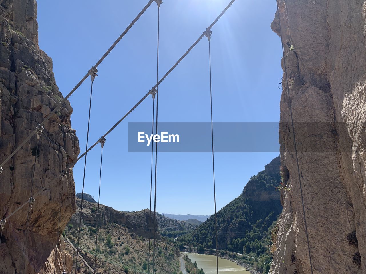 Panoramic view of bridge and mountains against clear sky