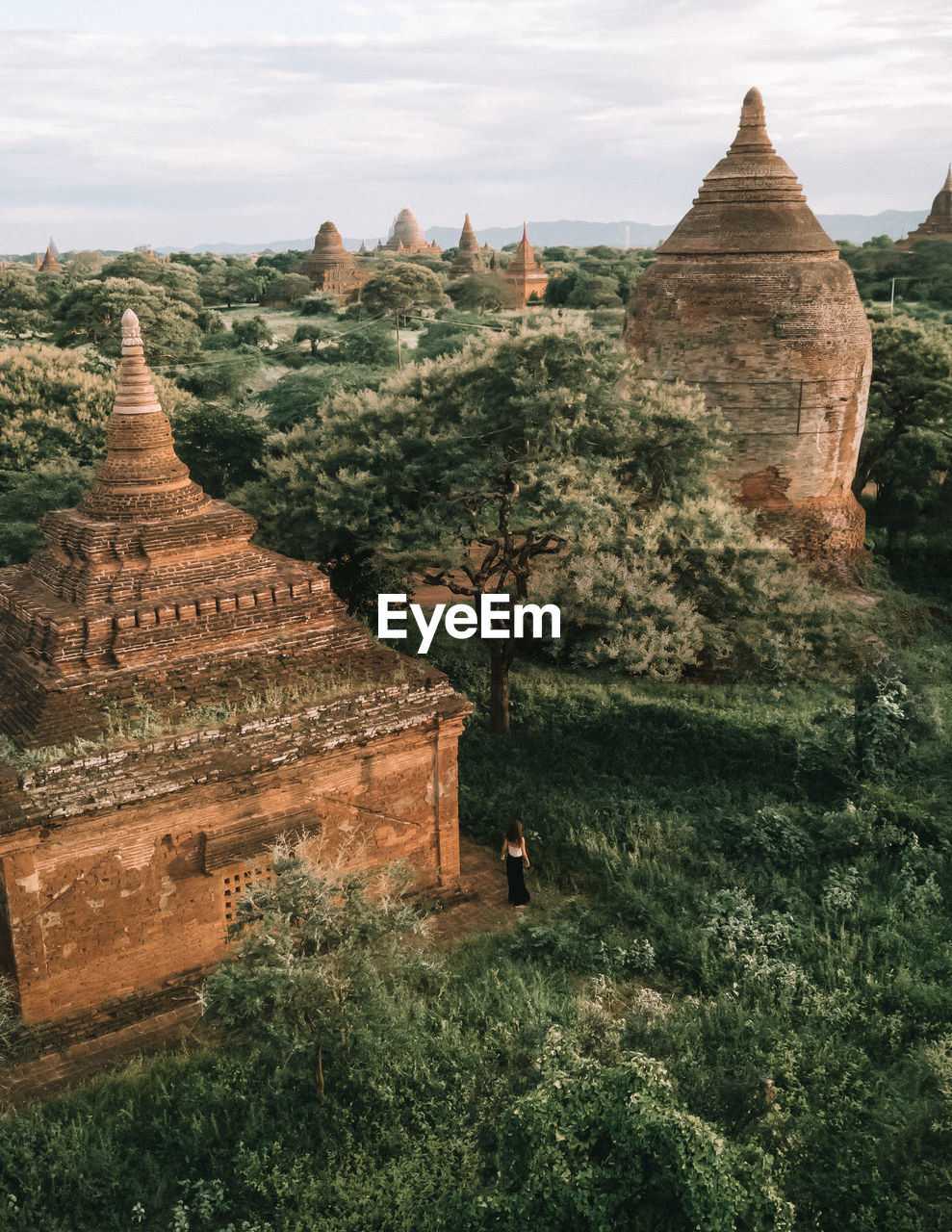 High angle view of woman standing by ancient temple