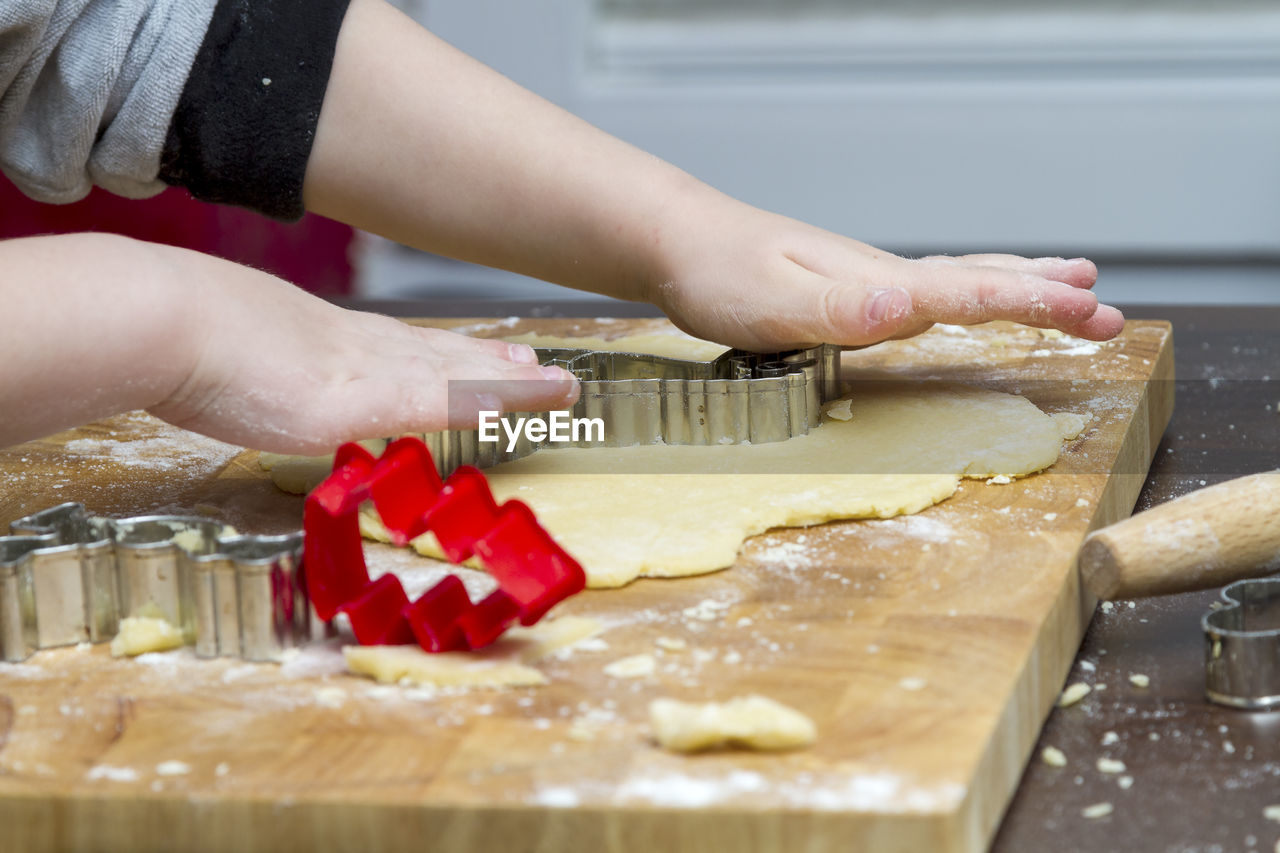 Close-up of woman preparing food in kitchen