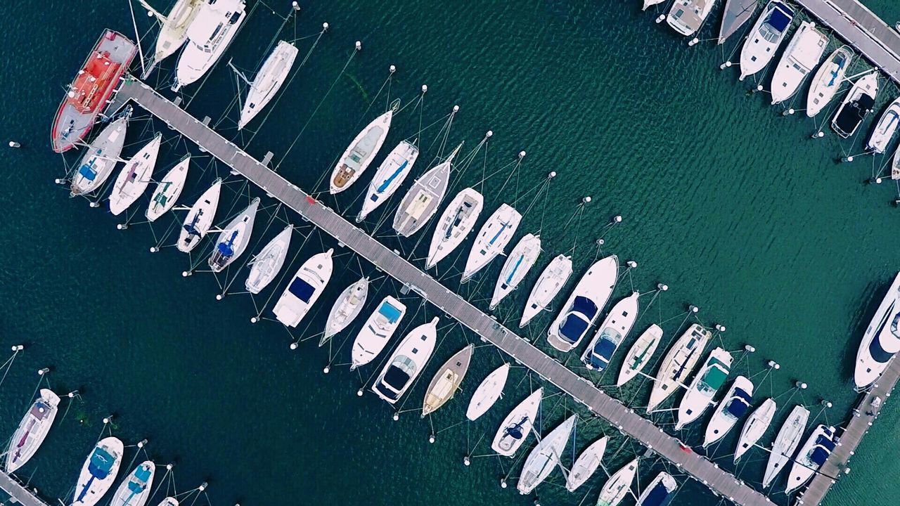 High angle view of boats moored at harbor