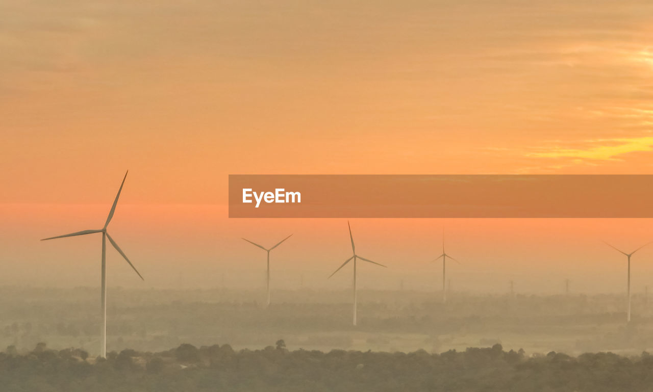 Landscape wind farm with sunrise sky. sustainable renewable energy. wind power for sustainability.