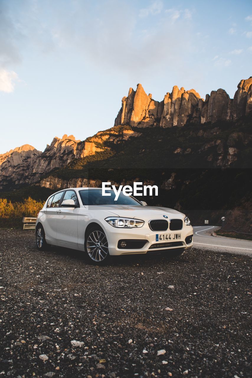 Car on mountain against sky