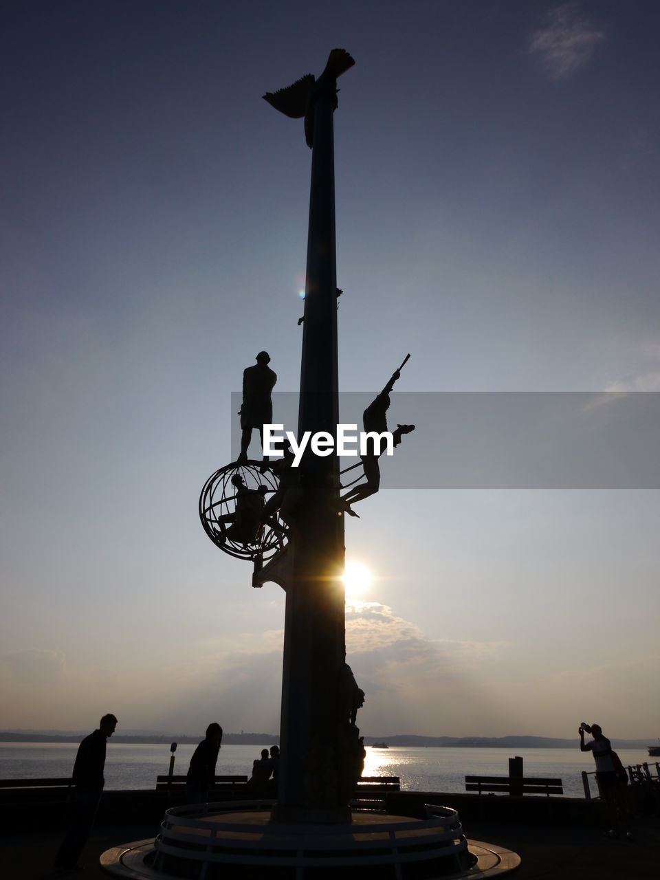 LOW ANGLE VIEW OF SILHOUETTE SCULPTURE AGAINST SKY