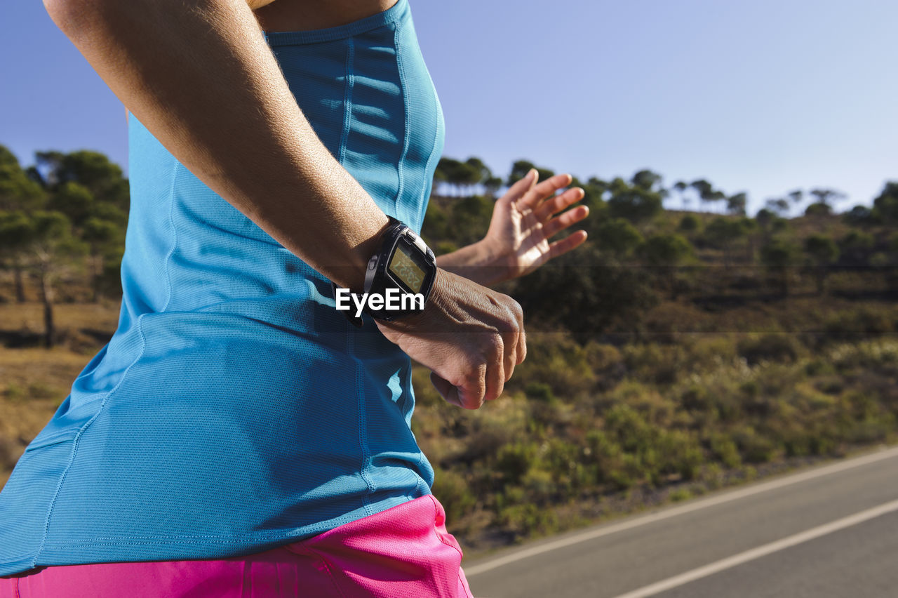 Woman jogging on road