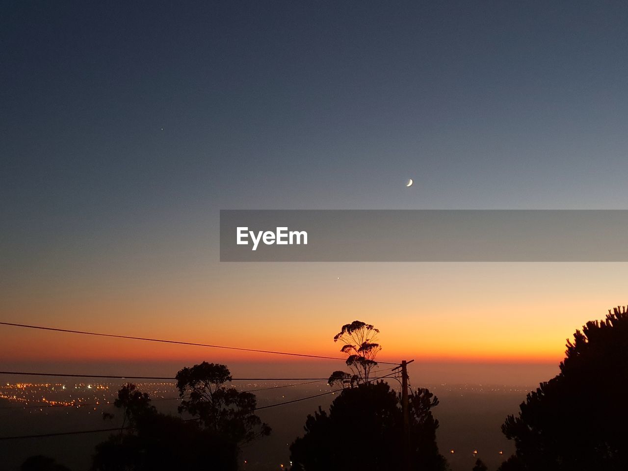 SCENIC VIEW OF SILHOUETTE TREES AGAINST SKY AT SUNSET