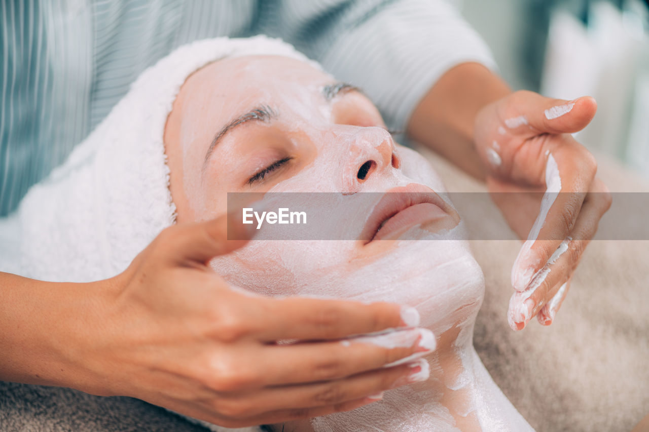 Close-up of woman getting massage therapy at spa