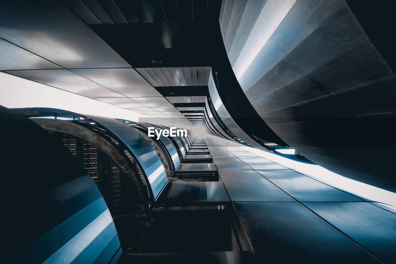 Low angle view of escalator in subway palace