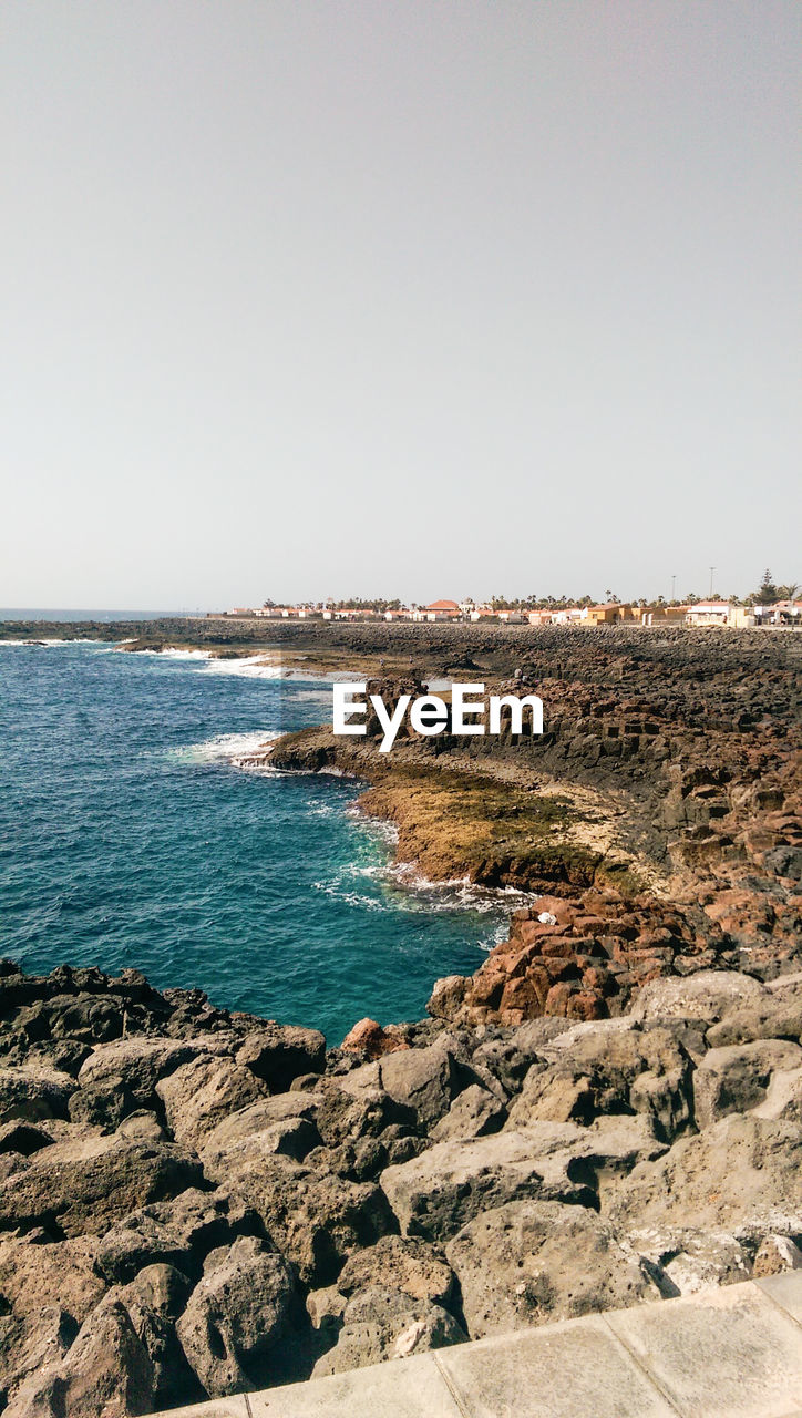 Scenic view of sea against clear sky