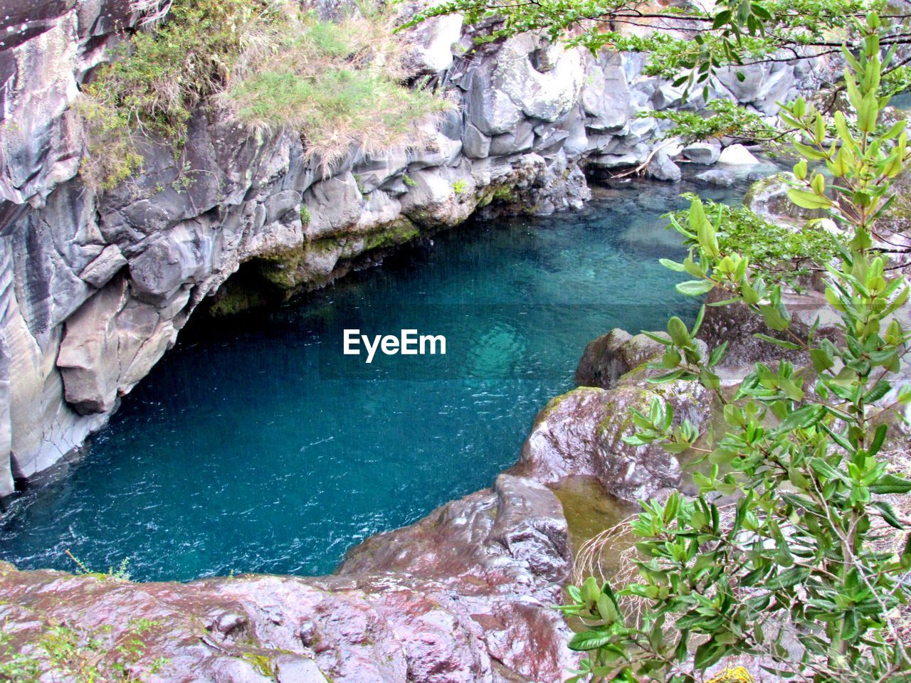 WATER FLOWING THROUGH ROCKS