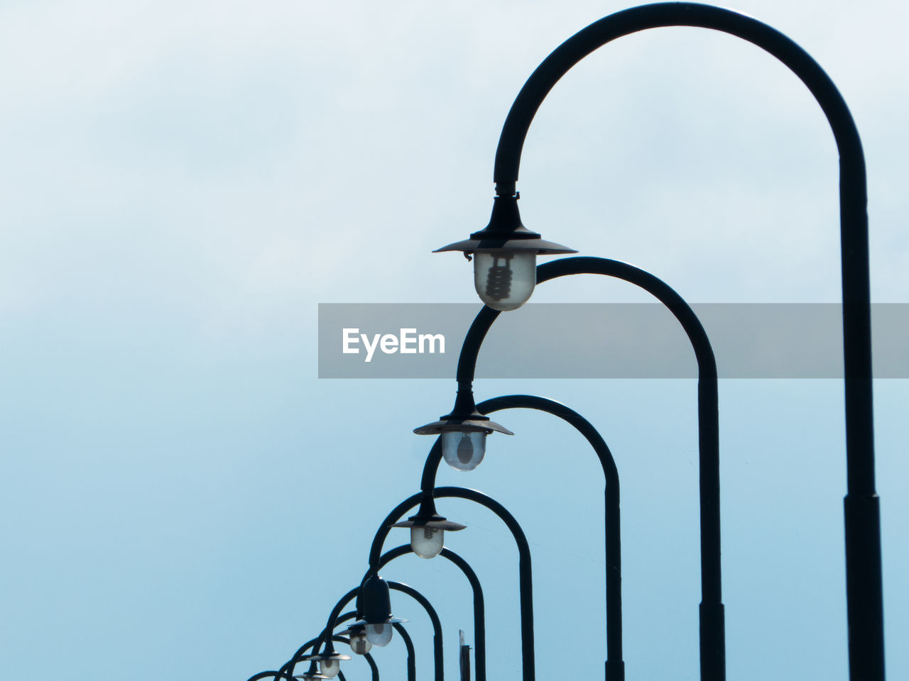 Low angle view of street light against sky