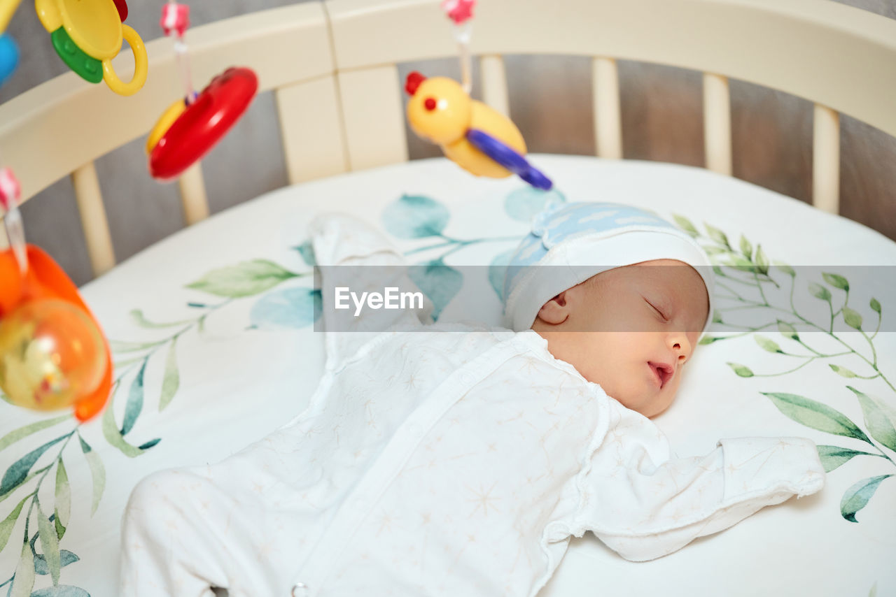 Cute baby sleeping in crib