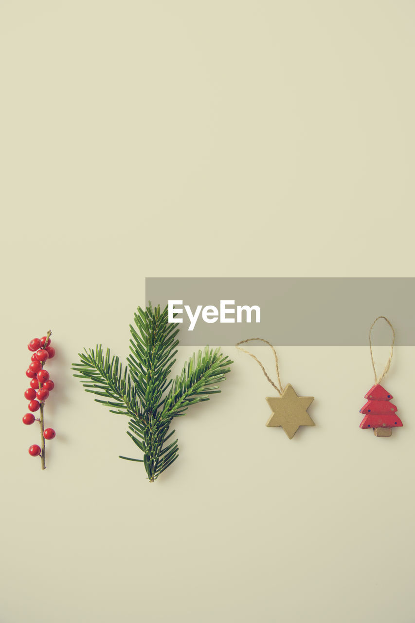 Close-up of christmas decorations against white background