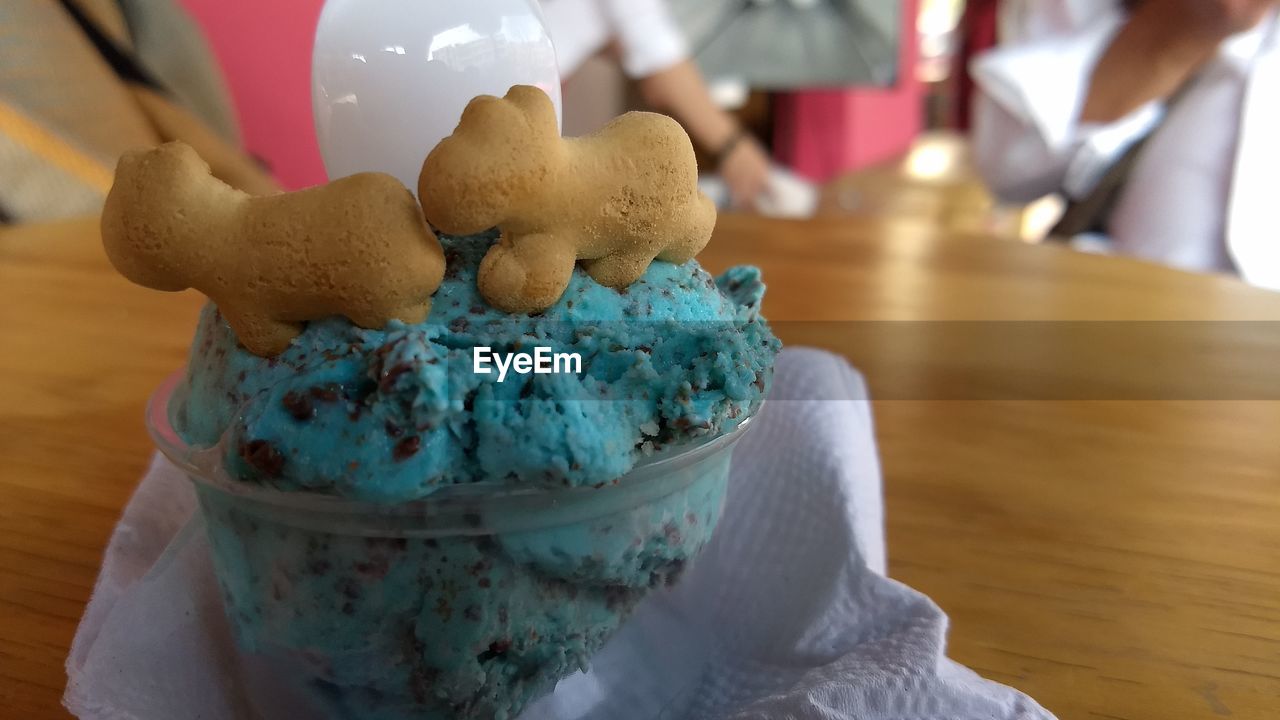 Close-up of ice cream and cookies in bowl on table