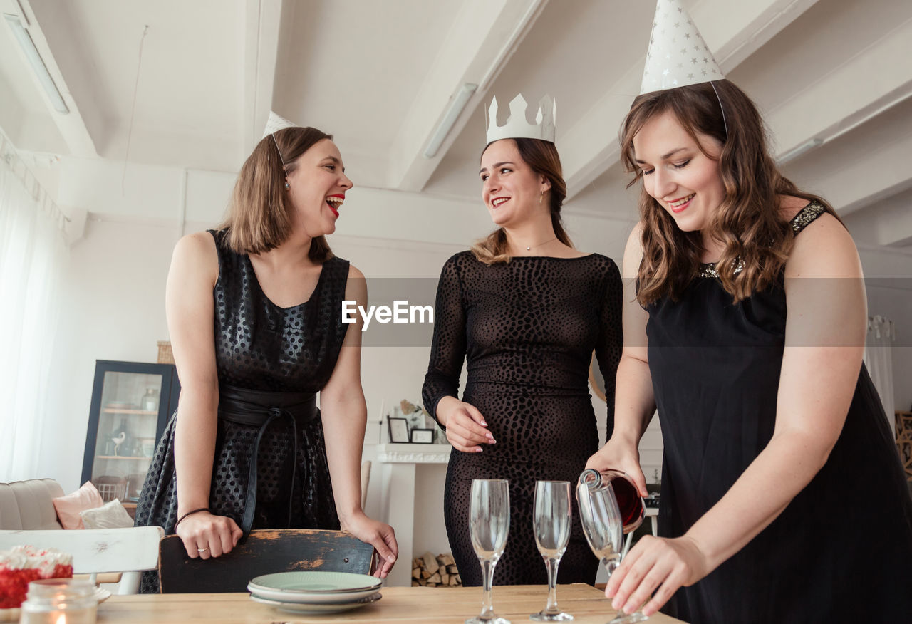 Smiling women enjoying party at home