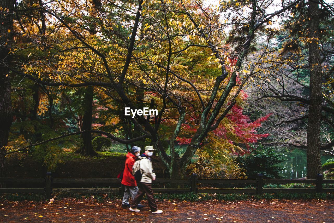 MAN STANDING IN PARK