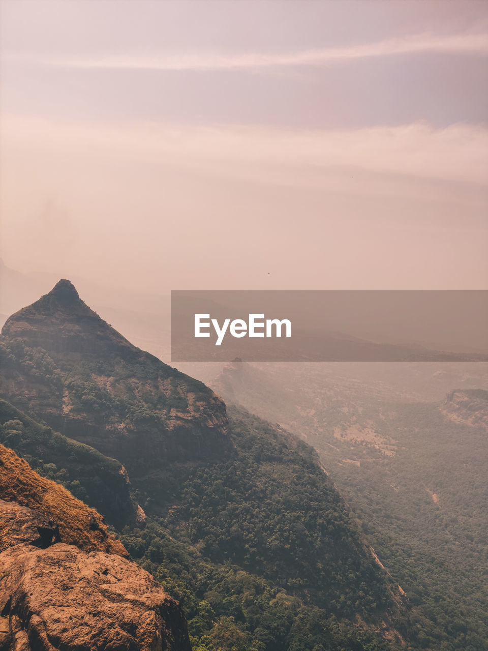 Scenic view of mountains against sky during sunset