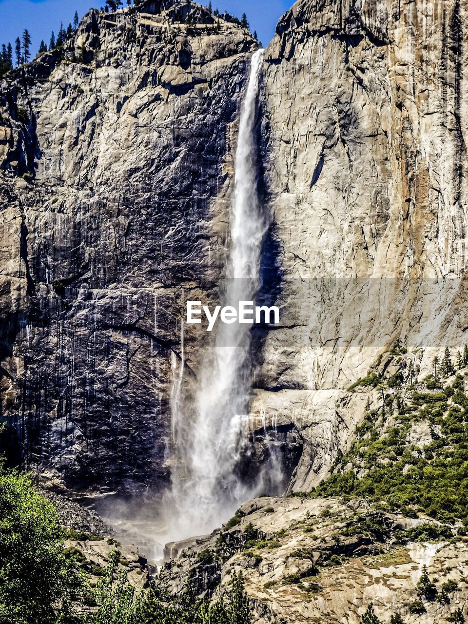 VIEW OF WATERFALL WITH ROCKS