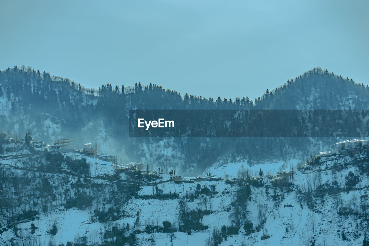 Panoramic view of snowcapped mountains against sky