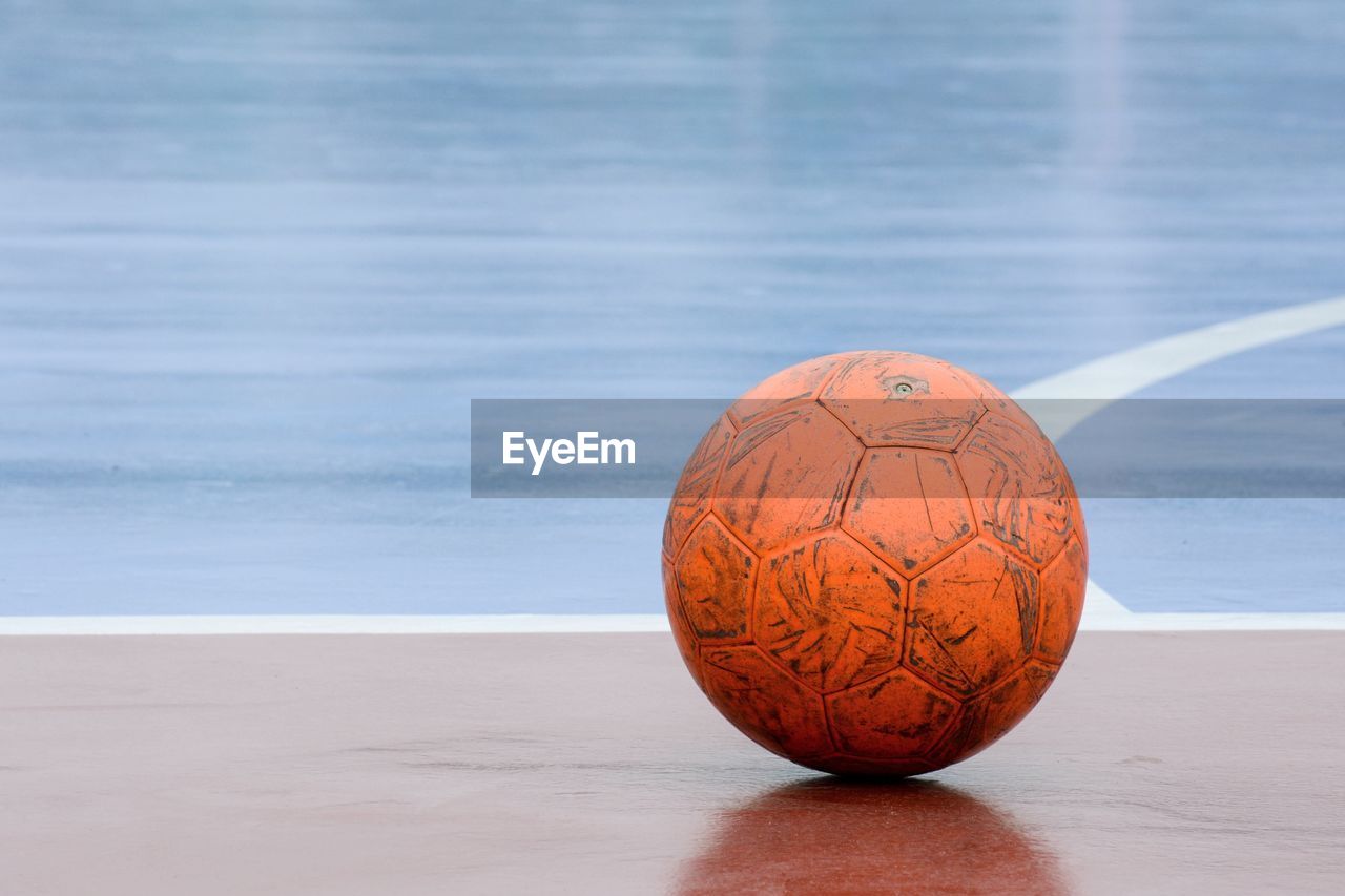 Close-up of soccer ball on court