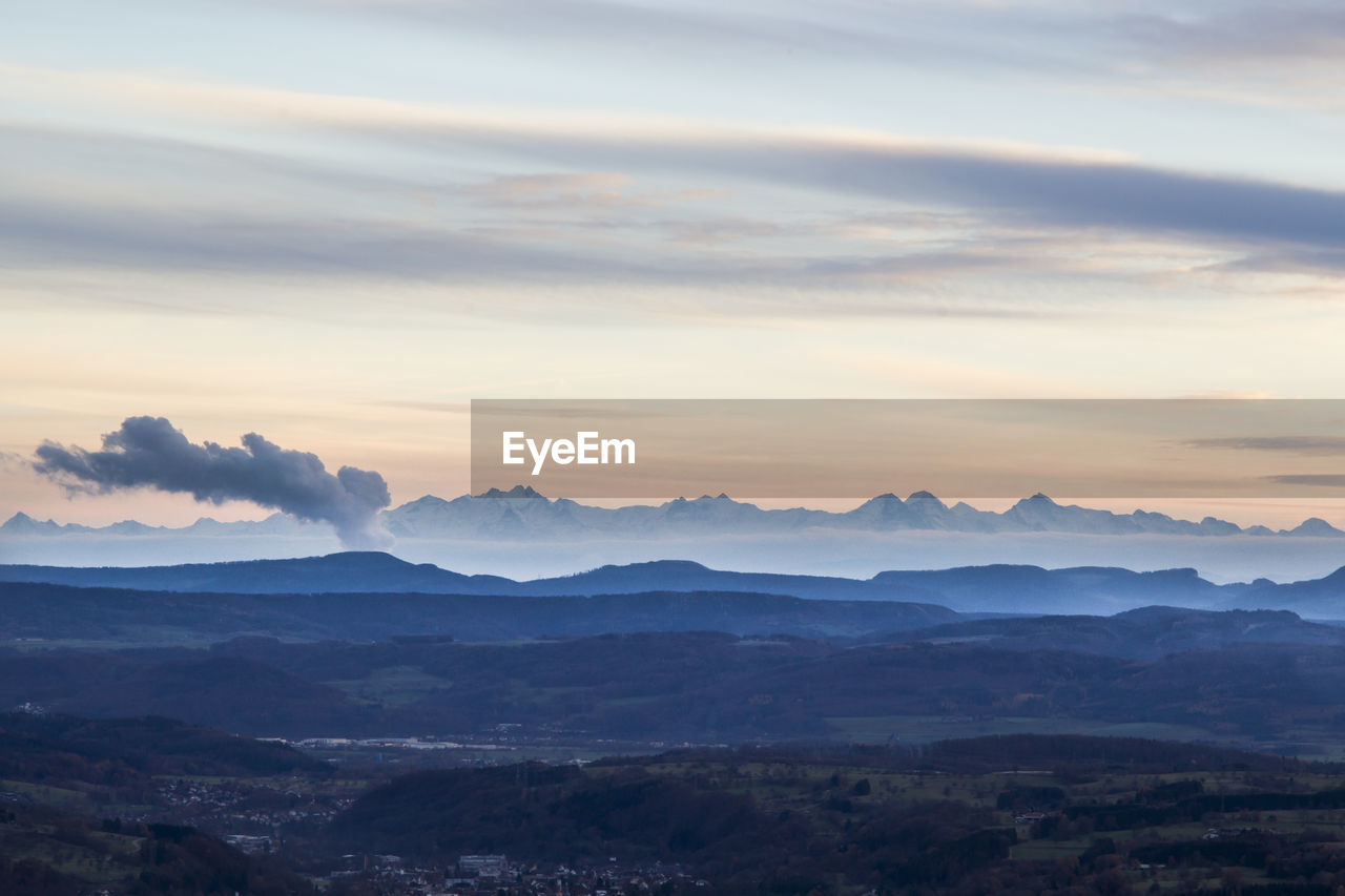 Scenic view of mountains against sky during sunset